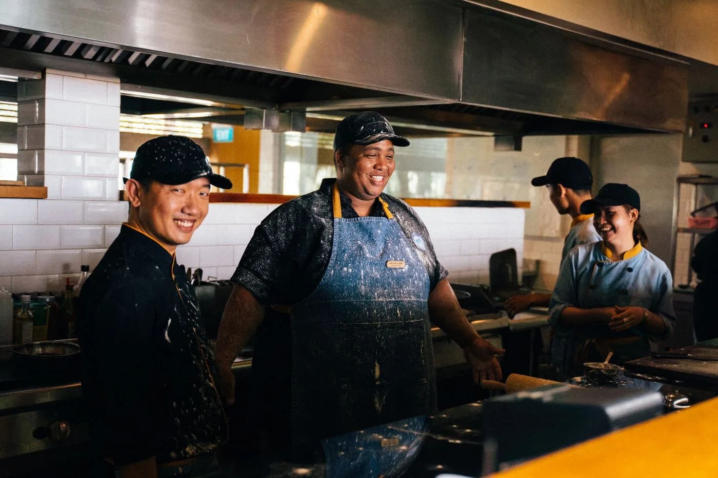Restaurant kitchen team working together during service